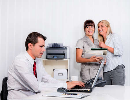 bullying in the workplace an office. women are talking about colleagues bullying in the workplace an office. women are talking about colleagues