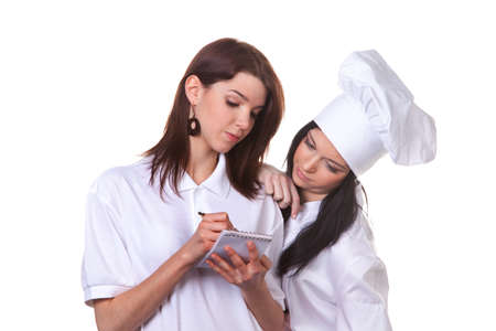 service and cook together to discuss the menuの写真素材