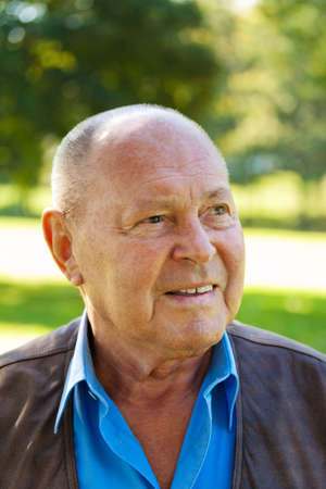 portrait of an elderly man. senior portrait outdoorsの写真素材
