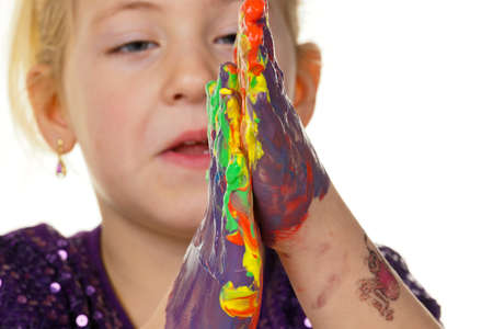 a child painting with finger paints. funny and creative.の写真素材