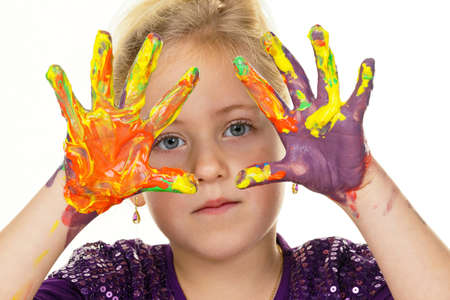 a child painting with finger paints. funny and creative.の写真素材