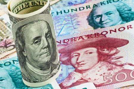 swedish krona, the currency of sweden. american dollar bills.の写真素材