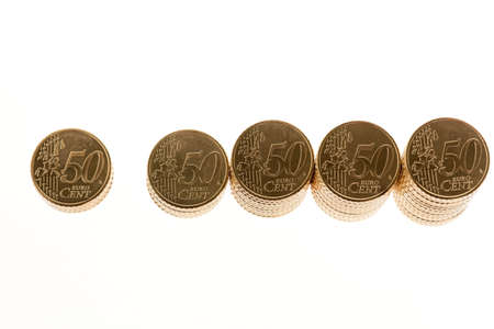 some stacks of coins on white background â¬の写真素材