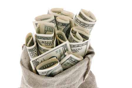 many dollar bills in a sack. white backgroundの写真素材