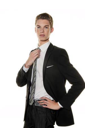 a skeptical young man in the studio. dressed in a suitの写真素材