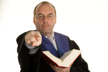a judge with a law book in court. book in hand.の写真素材