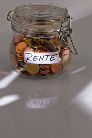 a jar of coins for the later pension age. supplementing this pensionの写真素材