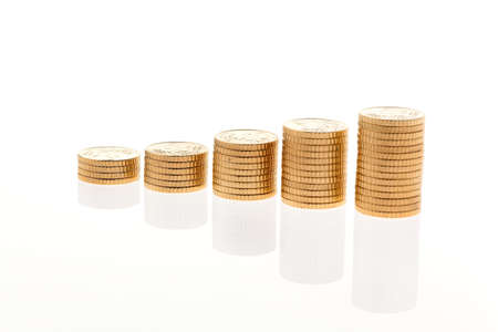 some stacks of coins on white background â¬の写真素材
