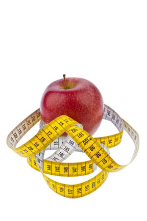 an apple and a tape measure for successful diet  on a white backgroundの写真素材