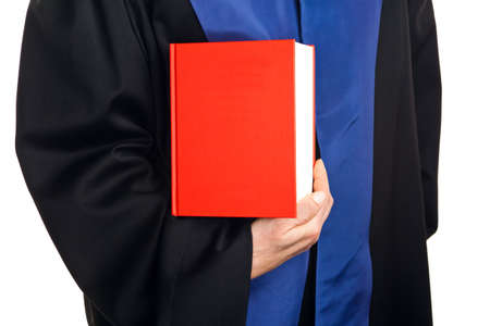 a judge with a law book in court  gavel in hand の写真素材