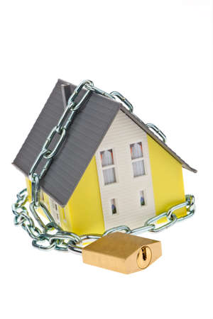 a house with chain and lock shut  alarm and security の写真素材