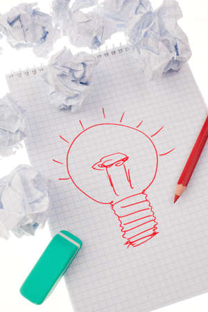 light bulb on drawing as a symbol of new ideas の写真素材