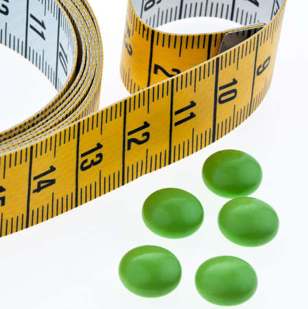 tape measure and tablets, as a symbol for diet pills  removeの写真素材