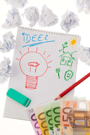 light bulb on drawing as a symbol of new ideas の写真素材