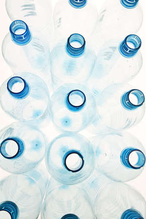 many of those empty plastic beverage bottles in front of white backgroundの写真素材
