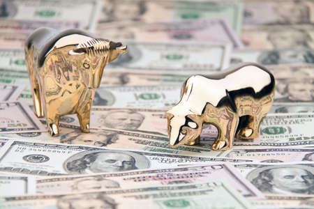 many dollar bills with bull and bearの写真素材
