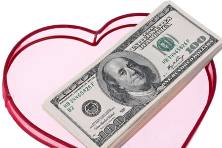 many dollar bills in a heartの写真素材