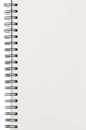 a ring binder for notes or collage block lies on a white backgroundの写真素材