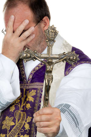 a catholic priest is desperatelyの写真素材