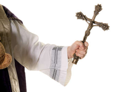a catholic priest with a cross in worship