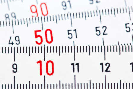 a white ruler of a carpenter is isolated on a white background 
