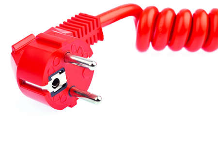 a red power cable with a connector located on a white backgroundの写真素材