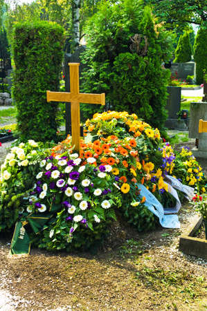in a cemetery, a grave is fresh after a funeral の写真素材