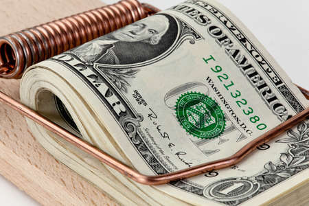 many american dollar bills in mousetrap  debt trapの写真素材