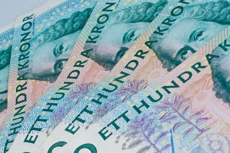 swedish krona, the currency of sweden  lie next to each other as subjects の写真素材