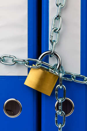 a file folder with chain and padlock closed  privacy and data security の写真素材