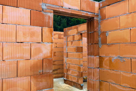the shell of a house in solid brick construction  construction site for construction の写真素材