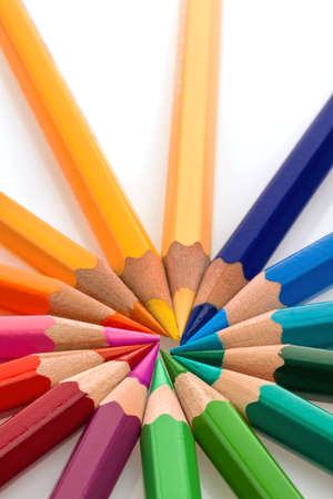 many different colored pencils on a white background の写真素材