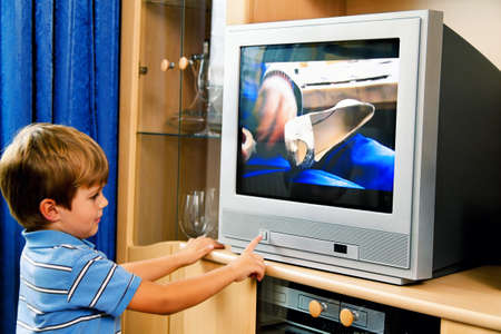 a small child watching tvの写真素材