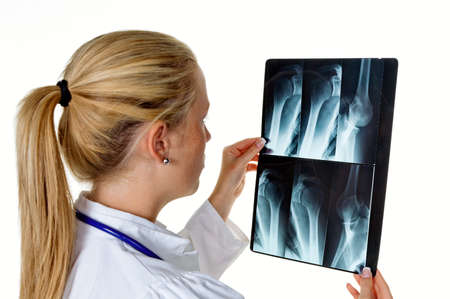 a young female doctor with stethoscope in her doctor s office 