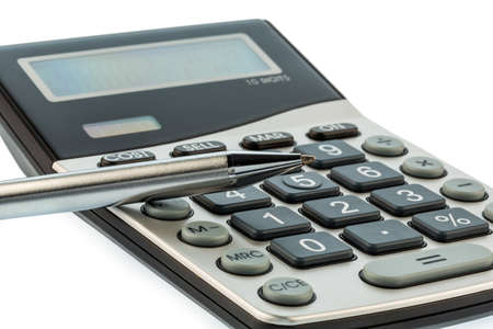 a red pen on a calculator  save on costs, expenditures and budget for bad economyの写真素材