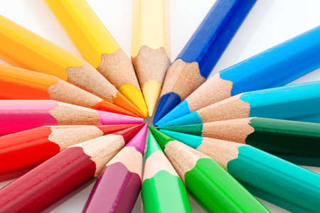 many different colored pencils on a white background の写真素材