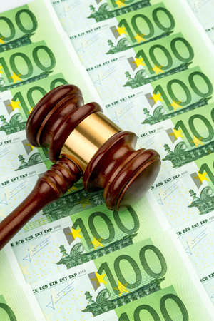 gavel and euro banknotes  symbol photo for costs in court of law and auctionsの写真素材