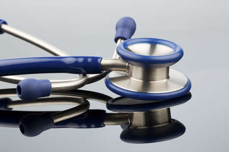 stethoscope against white background, photo icon for the medical profession and diagnosisの写真素材