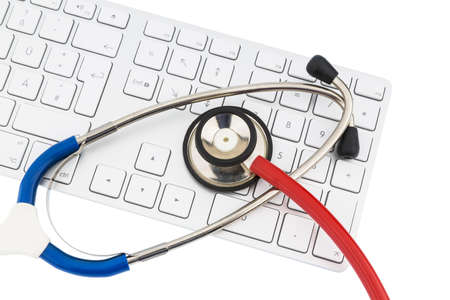 stethoscope and a computer keyboard, symbolic photo for diagnosis and event managementの写真素材