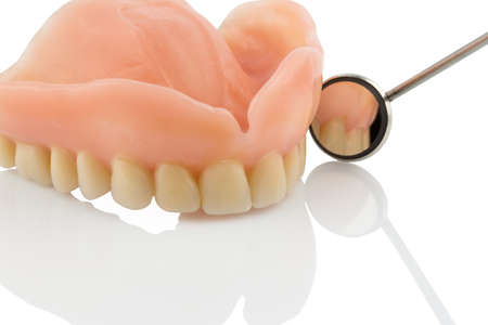 teeth and dental mirror, symbol of dentures, diagnosis and copayment