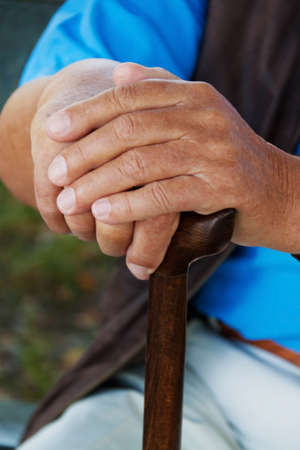 hand of an elderly man with a walking cane  senior with disabilitiesの写真素材