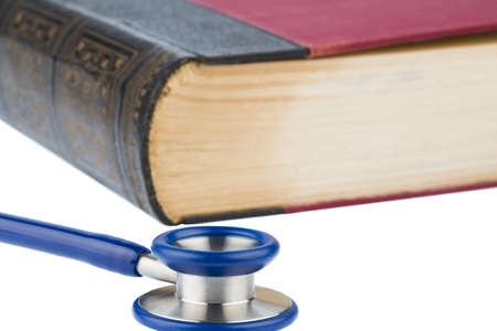 book and stethoscope, symbol photo for bungling, doctors mistake and expertiseの写真素材