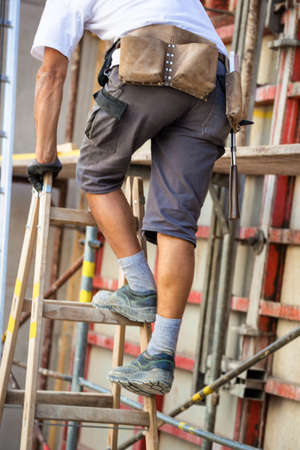 construction workers at the construction site of a new company and industrial building