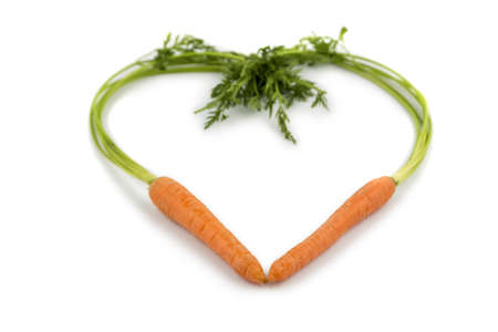 a heart made of organically grown carrots  fresh fruits and vegetables is always healthy  symbolic for healthy nutrition の写真素材