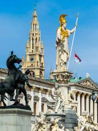 the parliament in vienna, austria  with the statue of  pallas athena  of the greek goddess of wisdom...