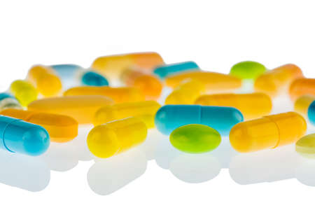 many tablets lying on a light background  symbolic photo for medicine and drugs the pharmaceutical...