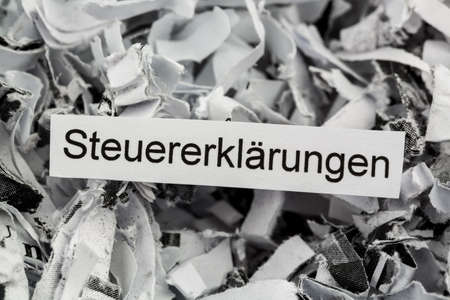 tagged with shredded paper tax returns, symbolic photo for tax burden and storage requirement