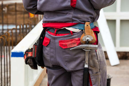 construction workers at the construction site of a new company and industrial buildingの写真素材