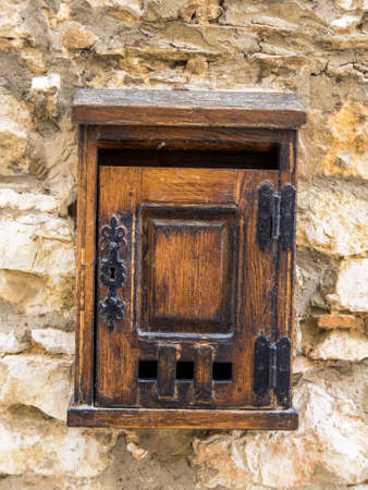 old wooden mailbox on a house wallの写真素材
