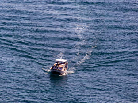 fishing boat on the way to the sea